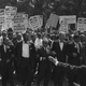 Marchers being led by organizers (Wikimedia Commons)